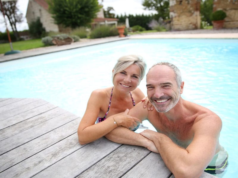 Older couple exercise pool